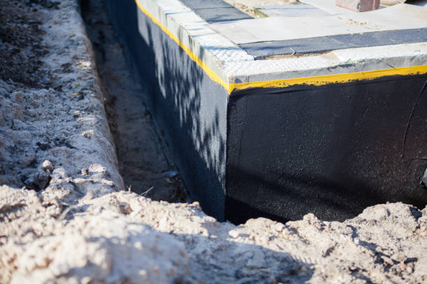 Professional Exterior Waterproofing technician working in Westwood, KS